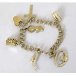 A ladies' silver charm bracelet and charms.