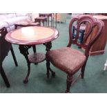 A cast iron pub table together with a Victorian chair.