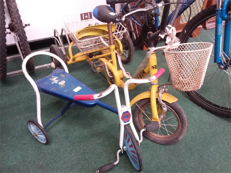 Two children's tricycles.