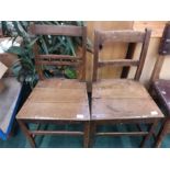 Two oak railback chairs.