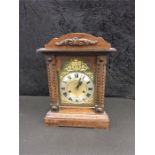 An oak cased mantle clock.