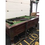 A Superleague coin operated Pool Table (50" x 87") together with various cues and balls.