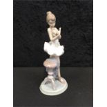 A Lladro girl figure 'For a Perfect Performance'.