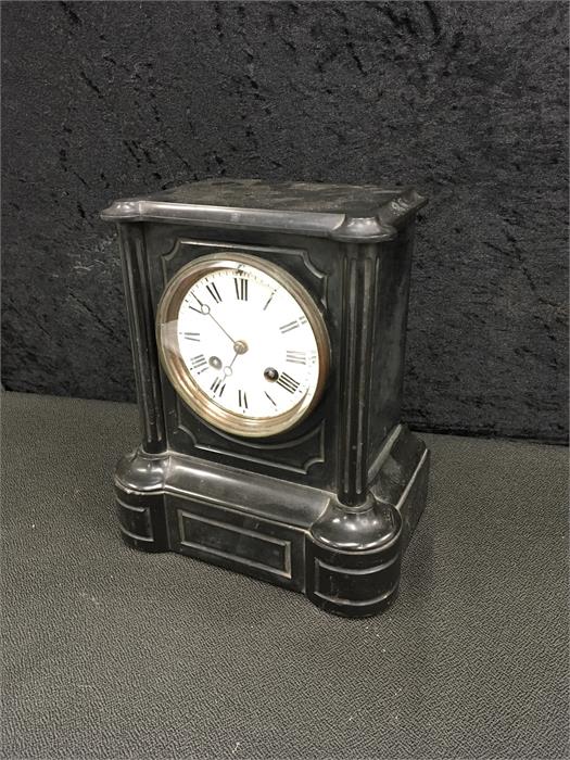 A black marble mantle clock, 9.5 inches.