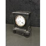 A black marble mantle clock, 9.5 inches.
