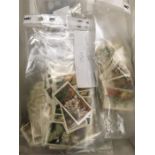 A small box of cigarette cards football, flowers, arms and armour etc.