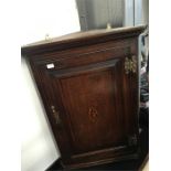 A19th century oak hanging corner cupboard with central shell motif and brass fittings (39" wide x