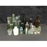 A large quantity of vintage glass bottles etc.