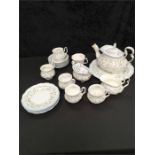 A Royal Albert teaset in the Caroline pattern including six cups, saucers and plates, bread and