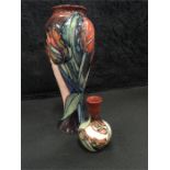 Moorcroft: A 10 inch red tulip vase by Sally Tuffin together with a 4 inch red tulip vase by Sally