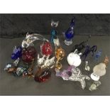 A large collection of small glass animals to include horses, rabbits, dolphin etc.
