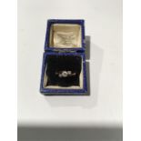 An 18ct gold three stone Diamond ring in a vintage Charles Fox box.