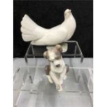 A Lladro dog with a dove.