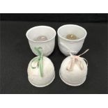 Two Lladro candle holders together with two Lladro bells (Winter and Spring).
