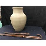 A Hillstonia earthenware pot measuring 19" together with a cudgen, a hardwood walking stick and a