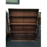 A late 19th century mahogany waterfall bookcase with four graduated shelves (44" high x 35" wide).