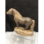 A Poole Pottery horse.