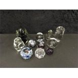 Eleven various glass paperweights.