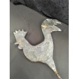 A weather vane in the form of a cockerel.