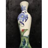 Moorcroft: An 8.5" vase of baluster shape with agapanthus and ladybirds.