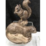 A Poole Pottery squirrel together with a Poole Pottery otter.