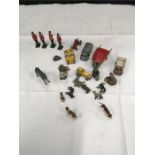 A quantity of Lesney and Britains lead and metal soldiers, farm vehicles and accessories.