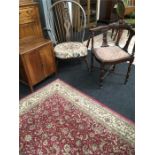 A 19th century mahogany corner chair, an Ercol style armchair and a small walnut veneer cupboard.