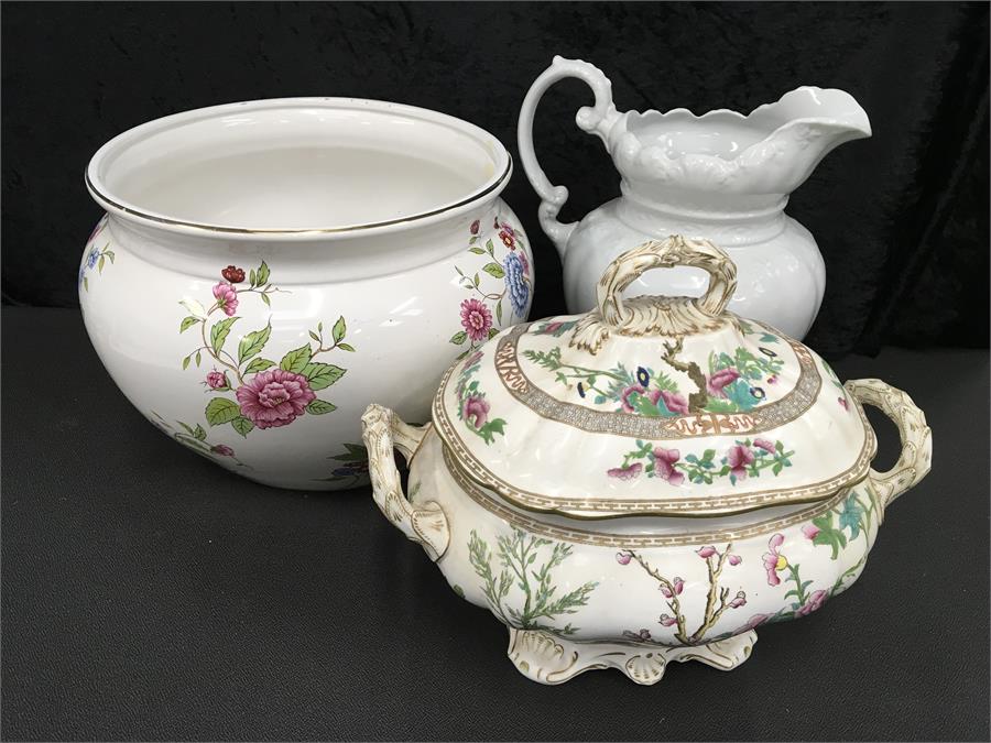A jardiniere together with a lidded twin handled pot and large white jug.