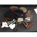 A quantity of naval and army hats with boys brigade belt, ammunition belt and other army ephemera.