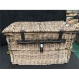A wicker trunk with a slider lock.