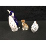 Crown Derby paperweights: Old Penguin together with Rabbit and Cheetah Cub.