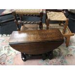 A small oak gateleg coffee table and four string top stools.