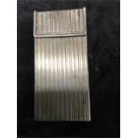 A Gucci white metal cigarette case with flip top and mark to interior (1.75" x 3.5").