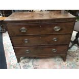 A Regency mahogany caddy top chest of three long drawers resting on outswept bracket feet.