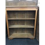 A 1920's oak bookcase with three adjustable shelves.