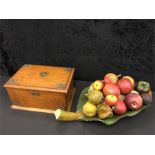 A wooden cigar box together with a wooden fruit basket.