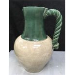 A large Pottery Ware jug with a rope twist handle (17 inches).