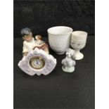 Lladro: A small clock together with a Grez finish boy and dog, a chalice, a candle holder with