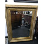 A large gilt framed mirror with bevelled plate 34" x 47".