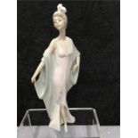 A Lladro figure of a 1920's lady.