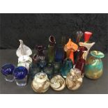 A large collection of small glass vases.