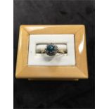 A natural blue Zircon and diamond ring set in 18ct gold (tested).