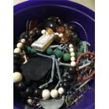 A carton of mixed costume jewellery.