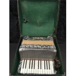 An Estella accordion in a case.