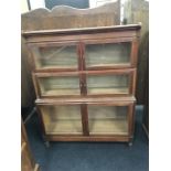 A Globe Wernick style bookcase in oak with three sections and glazed doors. (45" high).