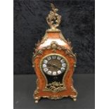 A French design German made metal mounted mantle clock with enamel dial.