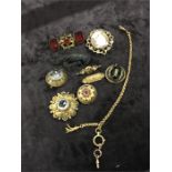 A quantity of 19th century costume jewellery to include a cameo brooch and others.