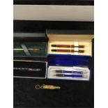 A Pierre Farber pen set, boxed together with a Cross 9ct rolled gold ballpoint pen and two other