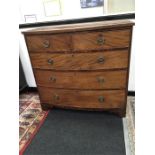 A Regency mahogany bow front chest of drawers with drop handles resting on bracket feet.