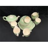 An Art Deco teapot and tea set to include 10 cups, 2 slops, 2 b+b, one milk jug (new hall).